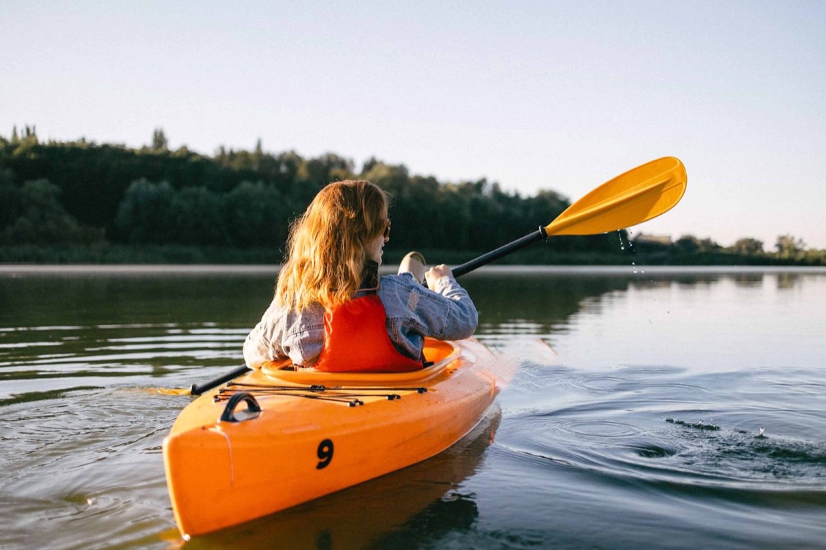 A woman kayaking on the calm waters near Mirissa